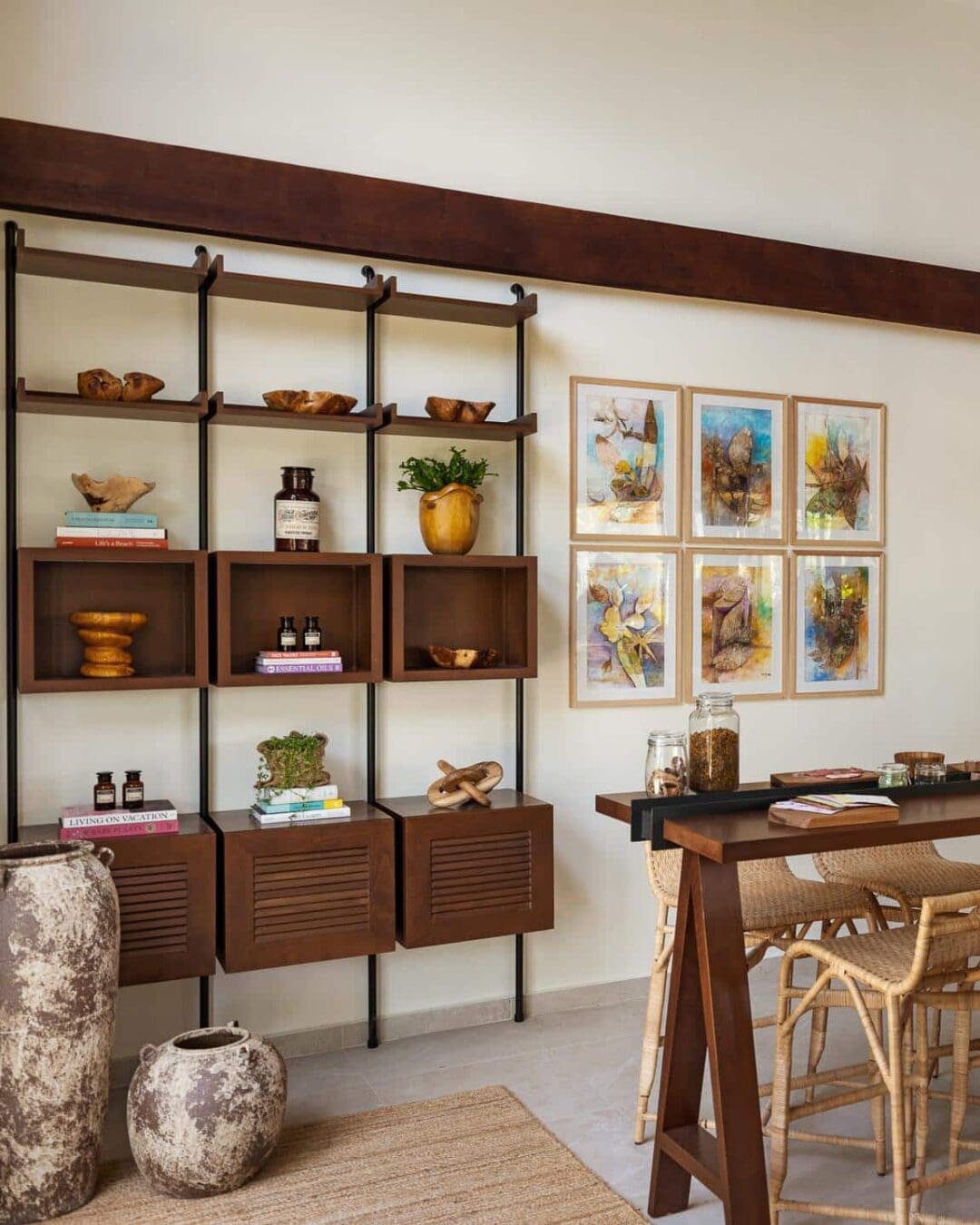 A light-filled interior at Six Senses La Sagesse with wooden shelving, natural textures, and locally inspired decorative details.