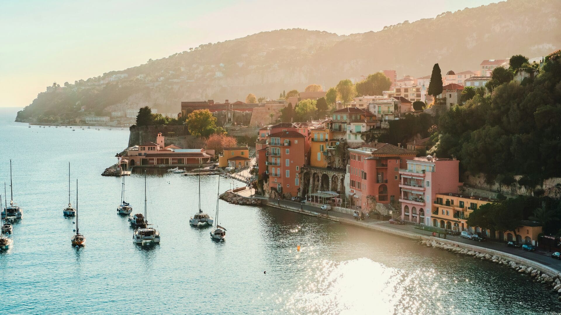 Villefranche-sur-Mer harbor with colorful buildings and boats on the French Riviera in spring
